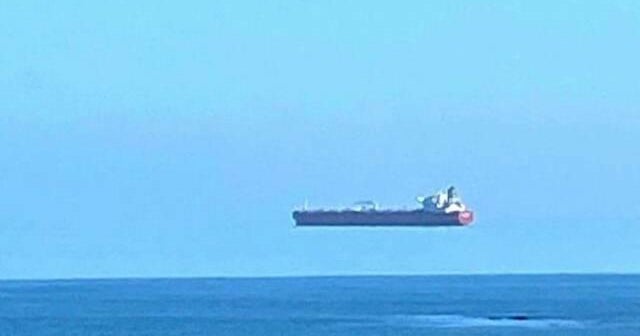 Optical illusion makes huge ship appear to float CBS News
