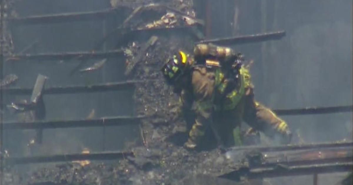 Watch Firefighter Falls Through Roof Of Burning Building Cbs News
