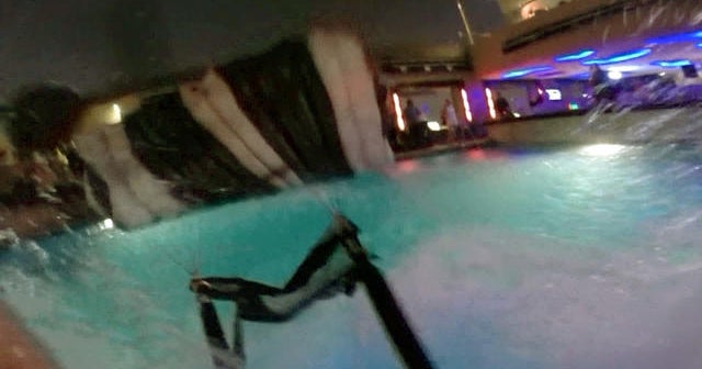 Watch: BASE jumper lands in rooftop pool