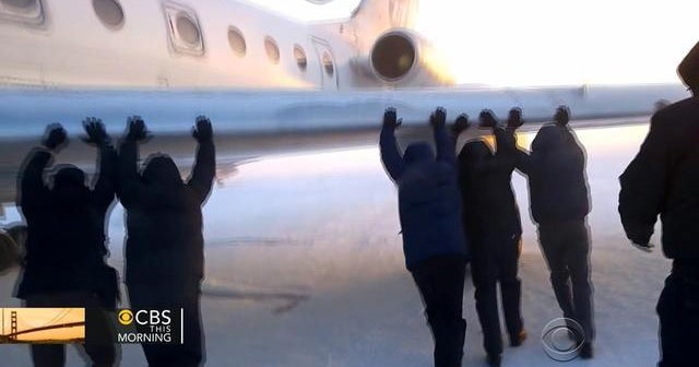 Watch: Passengers push frozen plane in Siberia