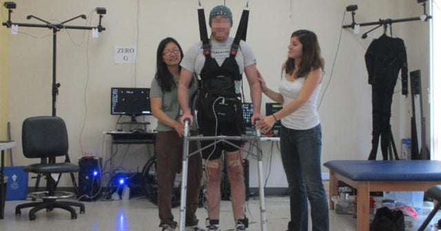 Brain power helps paralyzed man walk again