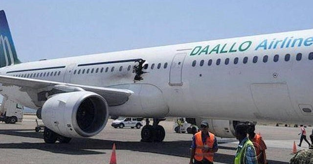 Midair explosion leaves hole in passenger plane