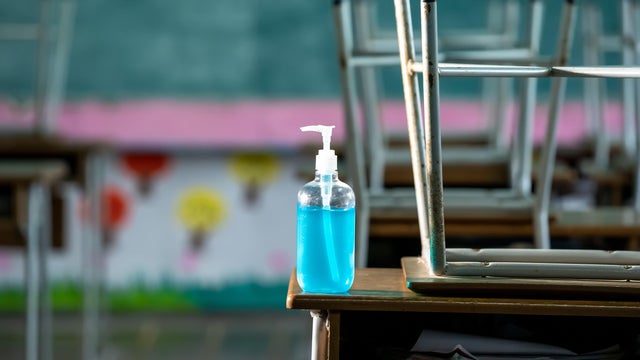 Disinfectant at elementary school student classroom desk. 
