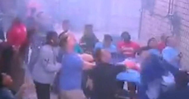 Watch Mother throws children from window of burning building CBS News