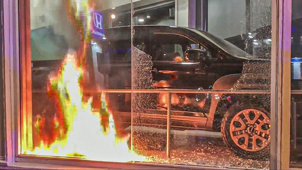 Protesters Set Fire at Car Dealership in Downtown Oakland 