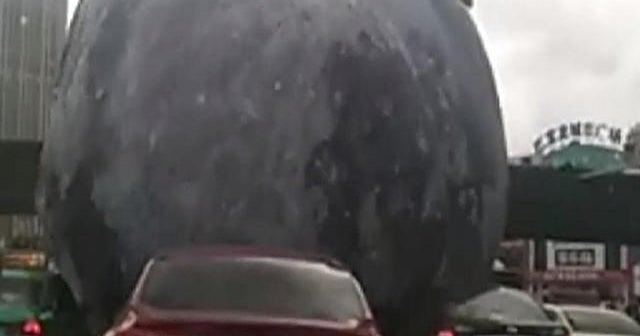 Typhoon sends giant inflatable moon for a joyride