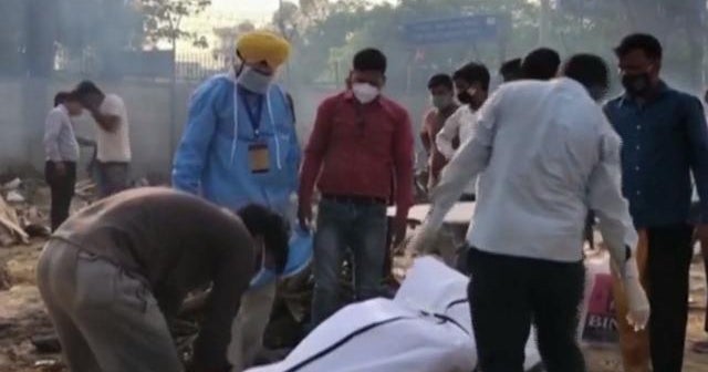 India in crisis as new COVID cases break global record