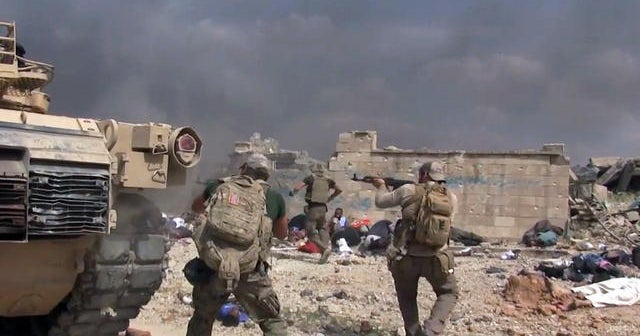 U.S. aid worker saves girl amid gunfire