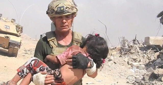 American aid worker runs through ISIS gunfire to rescue child
