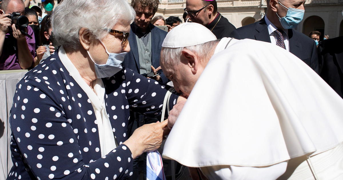 Pope Francis kisses Auschwitz death camp tattoo on a survivor's arm