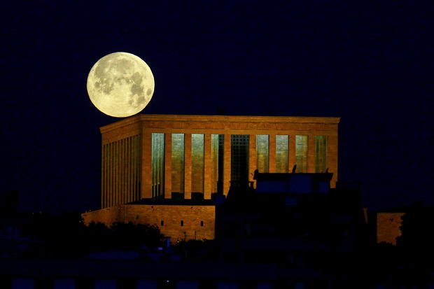 The full moon, known as the "Super Flower Moon", is seen over the Anitkabir in Ankara 