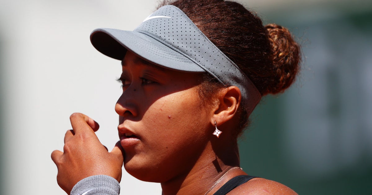 Naomi Osaka fined $15,000 and threatened with suspension for avoiding media at French Open - CBS News