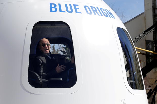 FILE PHOTO: Amazon and Blue Origin founder Jeff Bezos addresses the media about the New Shepard rocket booster and Crew Capsule mockup at the 33rd Space Symposium in Colorado Springs