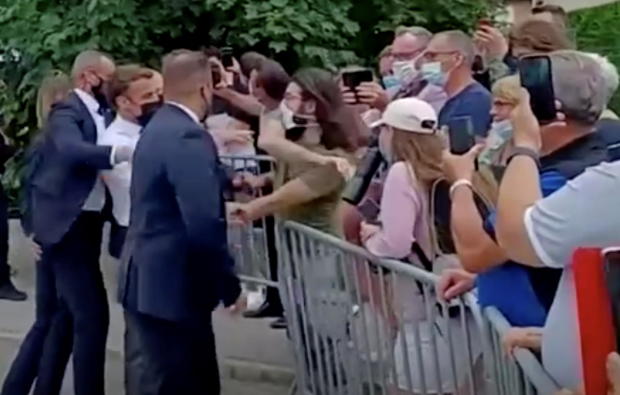 French President Emmanuel Macron gets slapped by a member of the public during a visit in Tain-L'Hermitage 