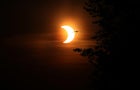 The morning of the eve of Ontario moving into Stage One of COVID-19 reopening is marked with a solar eclipse as viewed from the Beaches 