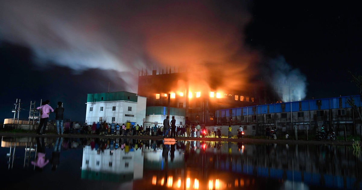 At least 52 killed in Bangladesh factory fire as workers trapped inside by an illegally locked door