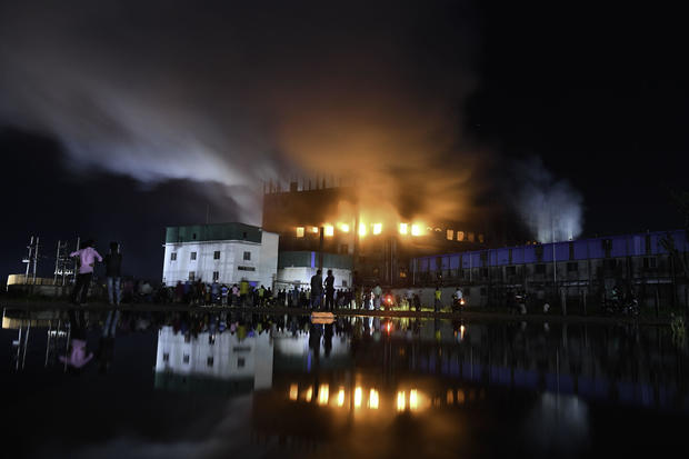 Firefighters try to extinguish fire inside the building 