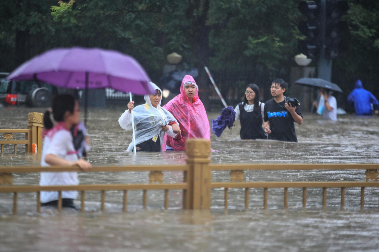 At least 25 dead as torrential rain floods Chinese city, trapping