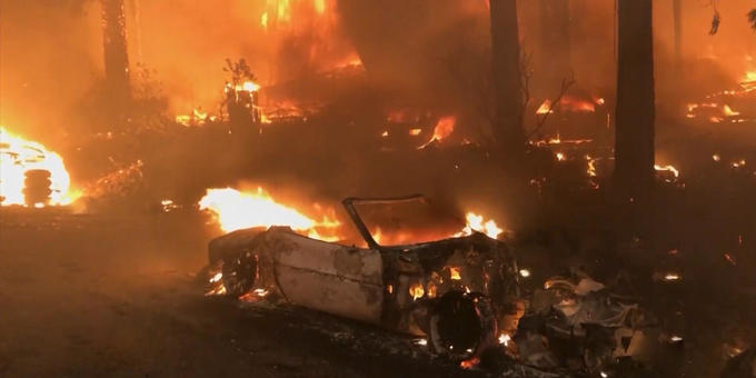 Thousands evacuated as "erratic" wildfires rage in California 