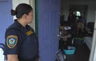 deputy-valencia-keeps-watch-as-crews-clear-the-apartment.jpg 