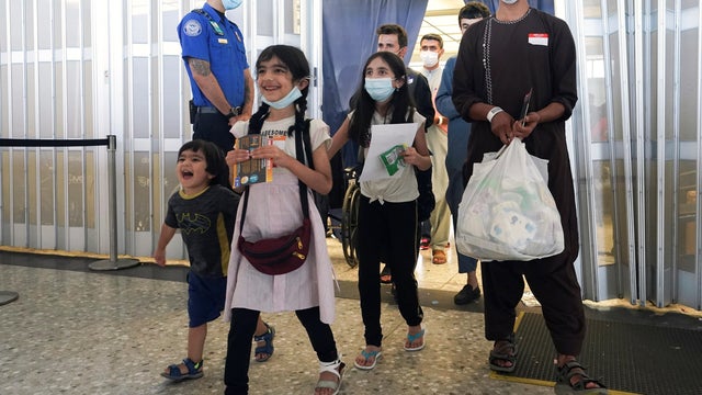 Afghan refugees arrive at Dulles Airport in Virginia 