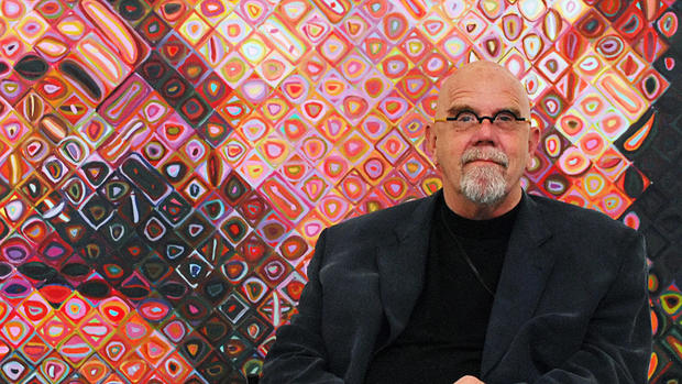 US artist Chuck Close sits in front of o 