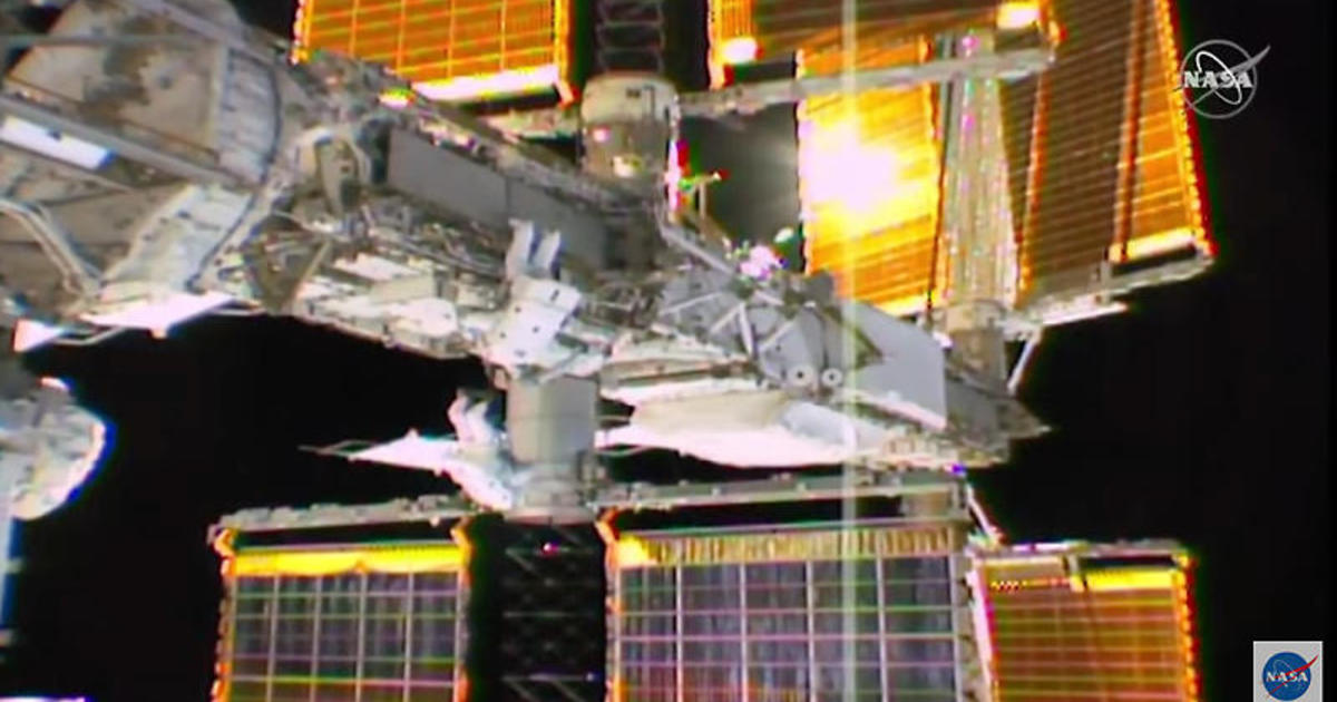 Spacewalkers carry out space station power system upgrades