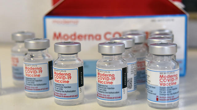 Moderna COVID-19 vaccine vials seen on a table 