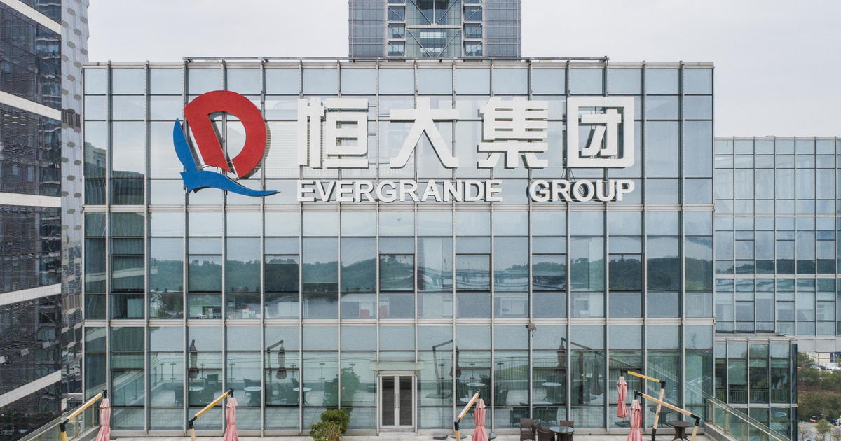 Evergrande defaults on $1.2B in foreign bonds, Fitch says, as China intervenes in debt-ridden real estate sector