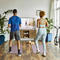 Couple Watching Online Exercise Class At Home 