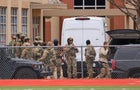 SWAT team members deploy near the Congregation Beth Israel synagogue in Colleyville, Texas 