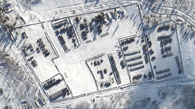 A satellite image shows a closer view of Russian tanks and artillery tents at Pogonovo training area 