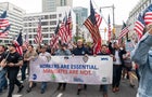Municipal workers of the city march across Brooklyn bridge 