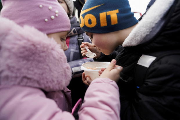 People fleeing violence in Ukraine at Polish border crossing 