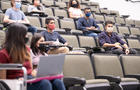 Multi ethnic university students in lecture hall 