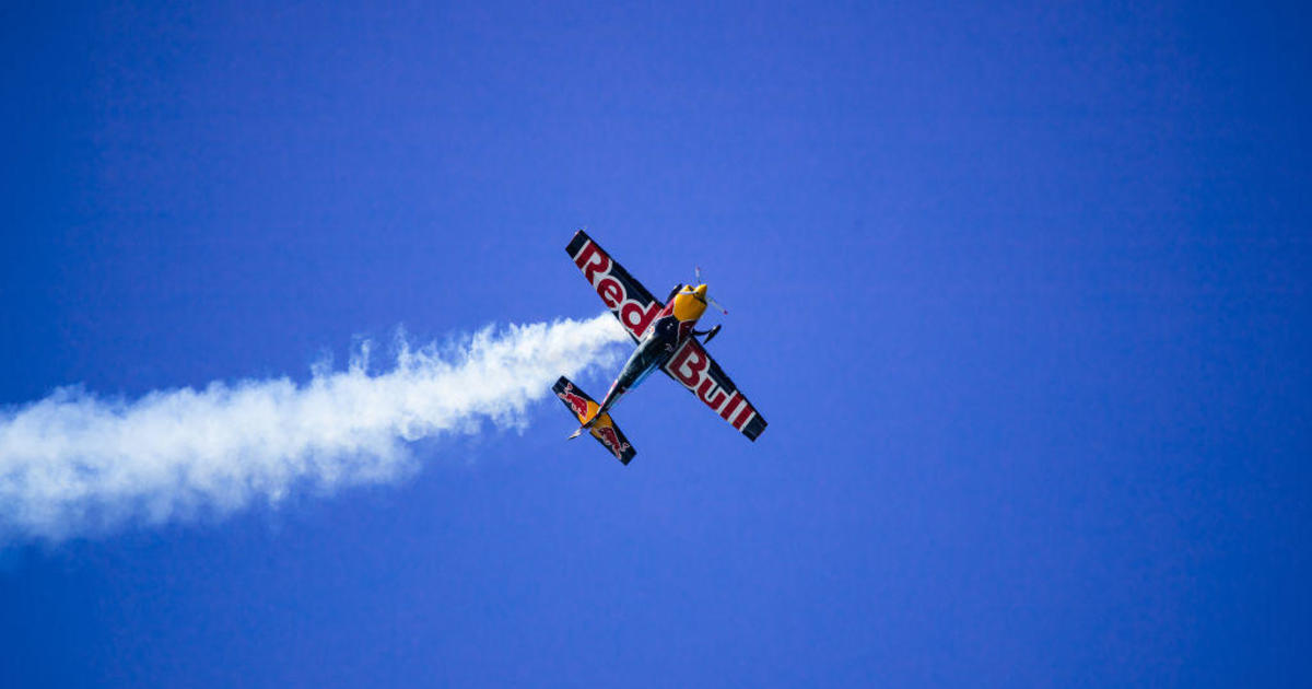 Red Bull plane crashes after failed plane swap stunt; pilot parachutes to safety