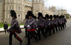 Coldstream guards march in front of Wind 