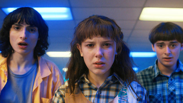 STRANGER THINGS. (L to R) Finn Wolfhard as Mike Wheeler, Millie Bobby Brown as Eleven and Noah Schnapp as Will Byers 