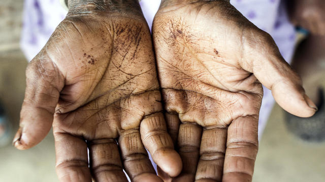 Woman cupping palms, close-up 