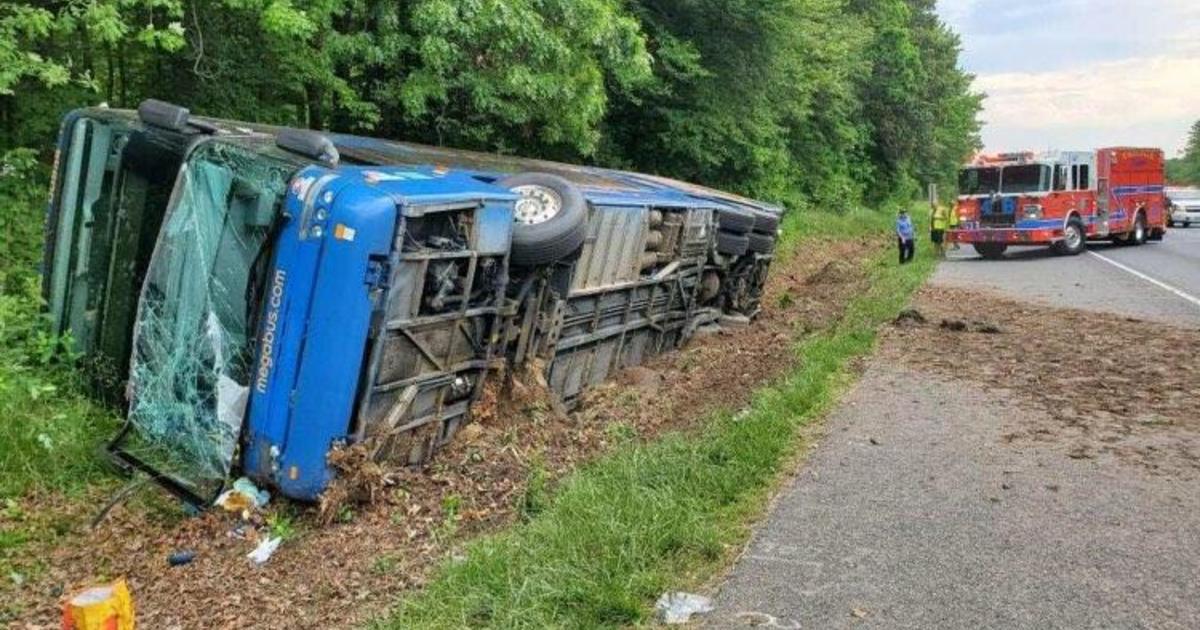 Bus rolls onto its side in Maryland, injuring 27